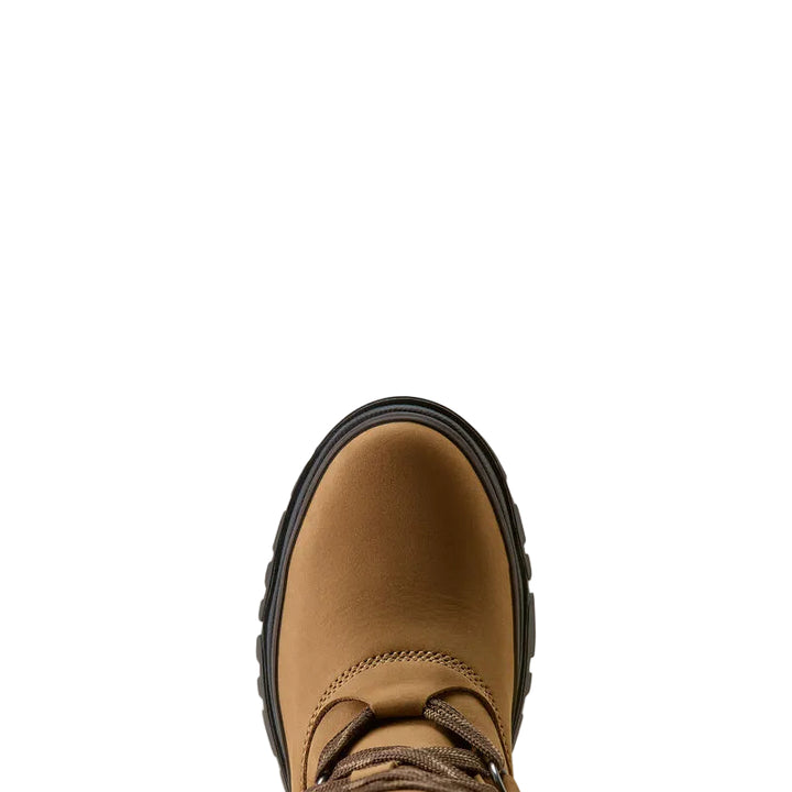 A close-up top-down view of a tan leather boot with a black sole, centered against a solid off-white background.