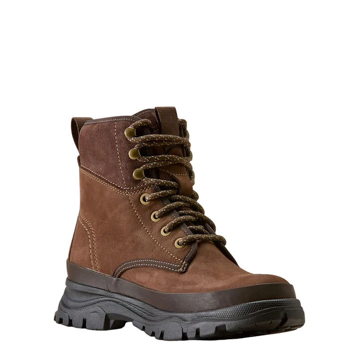 A brown suede lace-up ankle boot with a thick black lug sole, photographed on a clean off-white background.
