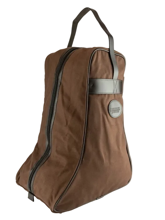 A brown canvas shoe bag with black trim, a top handle, and a silver-tone metal logo patch on the front, shown against a plain off-white background.