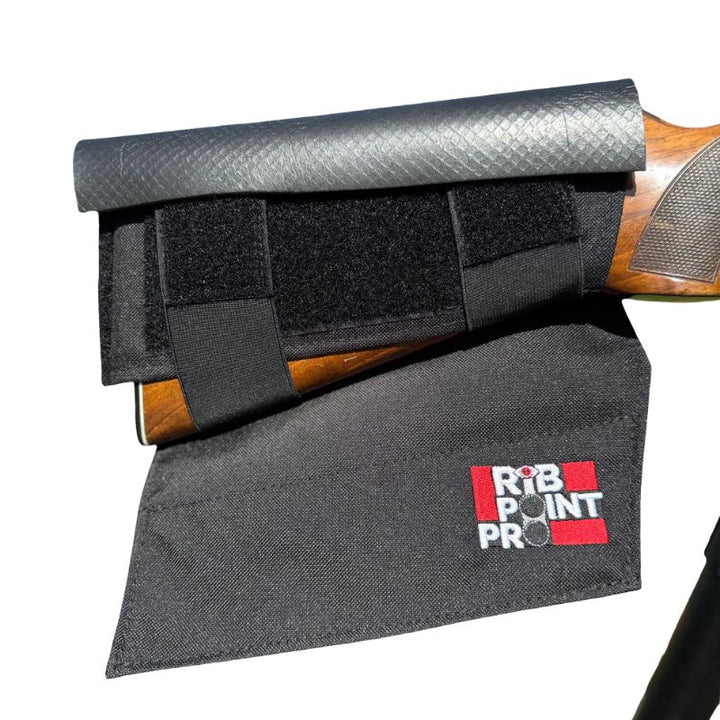 Black gun cleaning kit with rib point pro logo on a white background