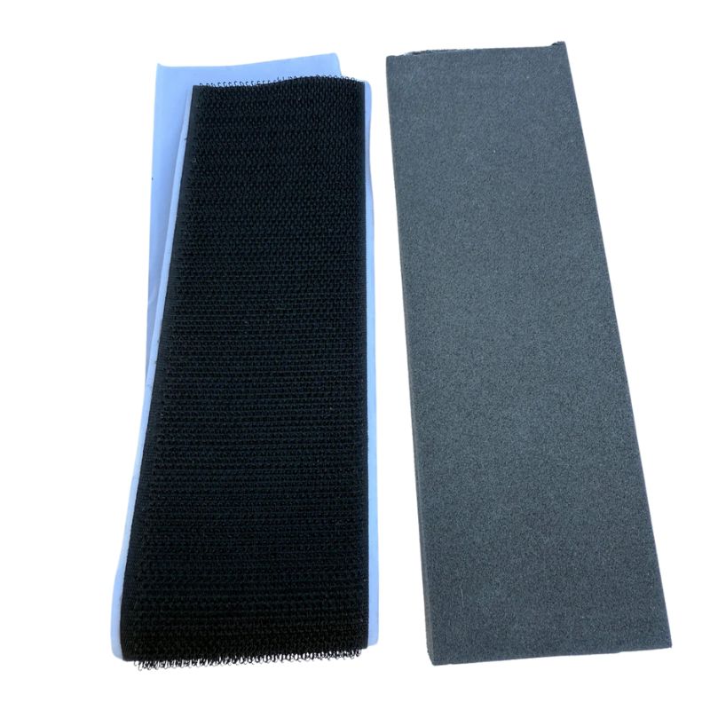 Three rectangular foam pads in black, blue, and gray on a white background