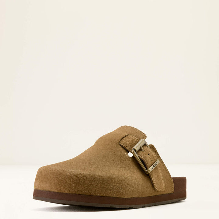 Ariat Men's Country Mule Tan Suede slip-on shoe, angled front view showing premium suede upper, Ariat branded metal buckle and brown sole.