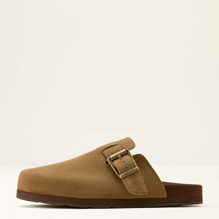 Ariat Men's Country Mule Tan Suede slip-on shoe, side profile showing soft suede upper, Ariat branded metal buckle, open back and durable brown sole.