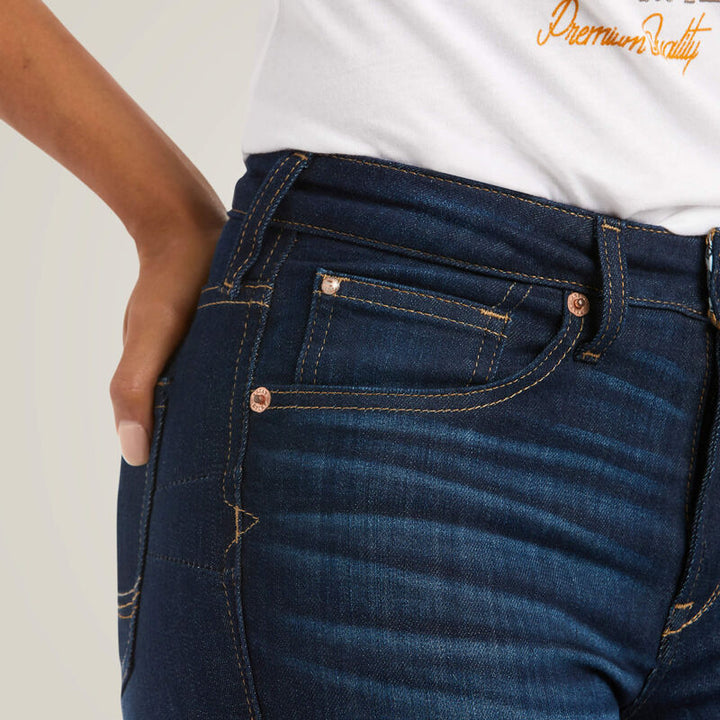 Ariat R.E.A.L. High Rise Ballary Boot Cut Jeans in Pennsylvania wash, close-up showing high-rise waistband, front pockets, copper rivets and contrast stitching on dark blue denim.