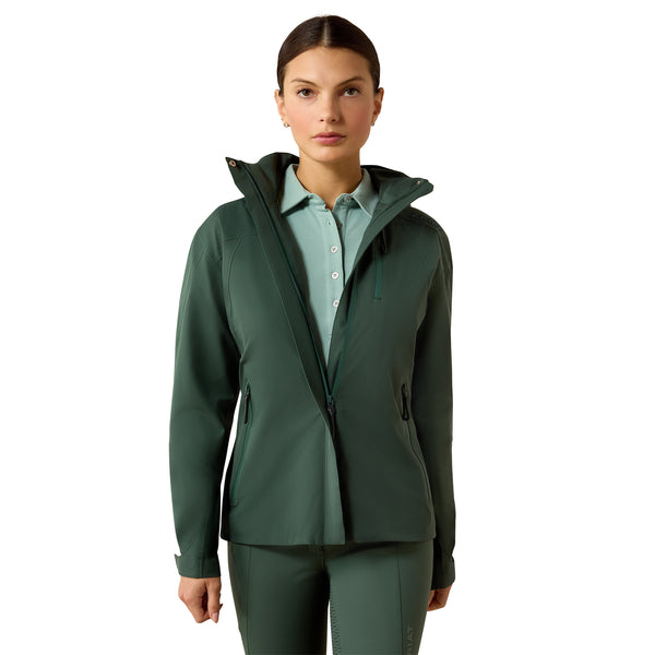 Woman wearing a green raincoat on a white background