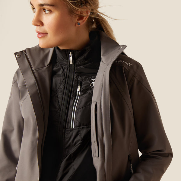 Woman wearing a black and gray jacket with Ariat logo on a white background