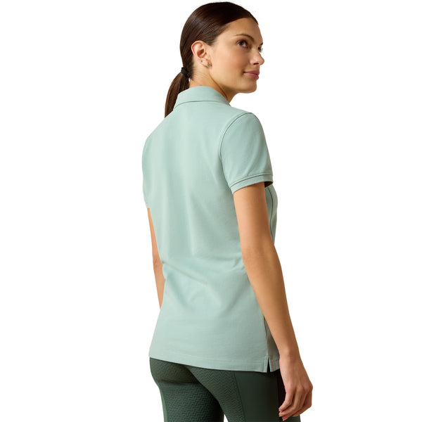 Woman wearing a light blue polo shirt on a white background
