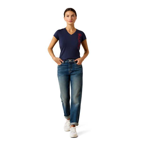 Woman wearing a navy blue t-shirt and blue jeans on a white background