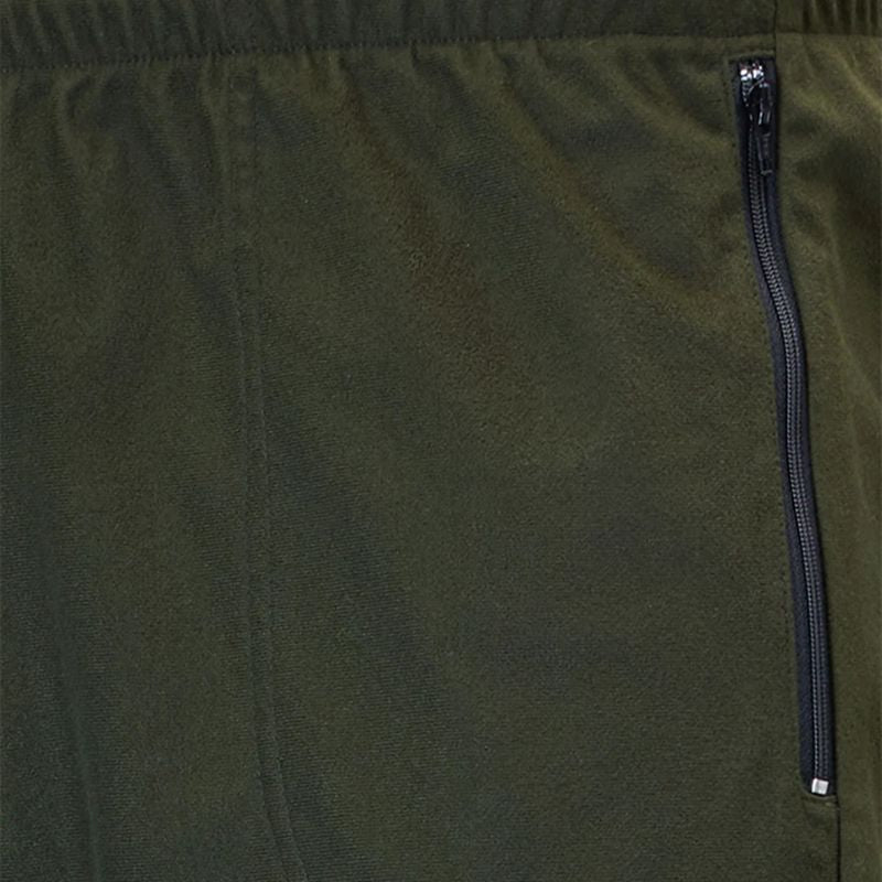 Close-up of olive green fabric with a vertical black zipper on the right side.
