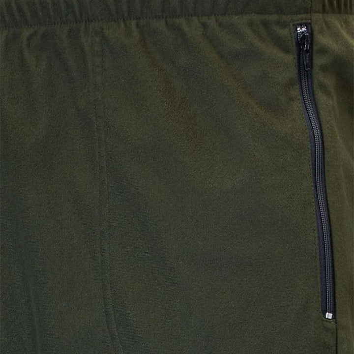 Close-up of olive green fabric with a vertical black zipper on the right side.