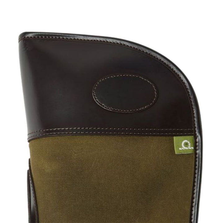 Brown leather and fabric bag with a visible brand logo on a white background